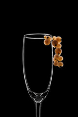 Outline of a glass with berries, mock-up, black background