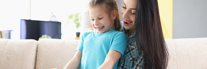 Cheerful child girl open present box and express happy emotions