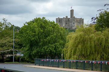 View of medieval Warkworth Castle from afar 