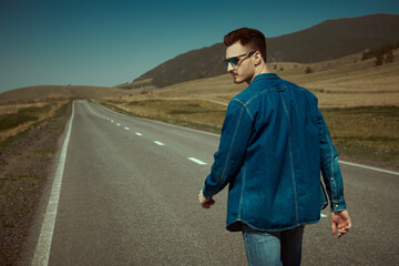 guy walking on highway