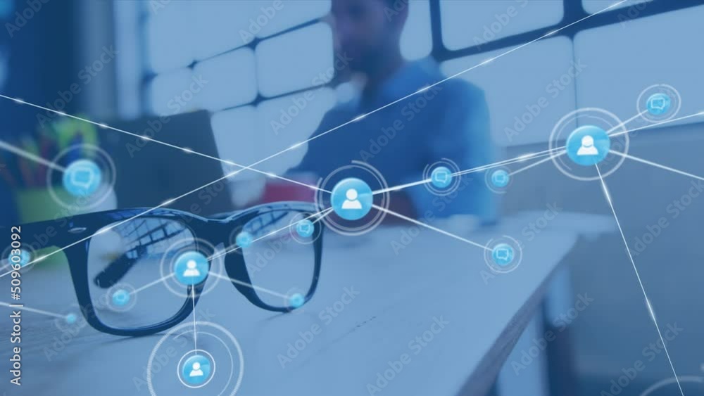 Poster animation of network of connections over biracial architect using laptop