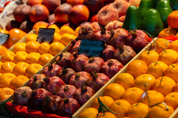 Colorful fruit berries are displayed in a market