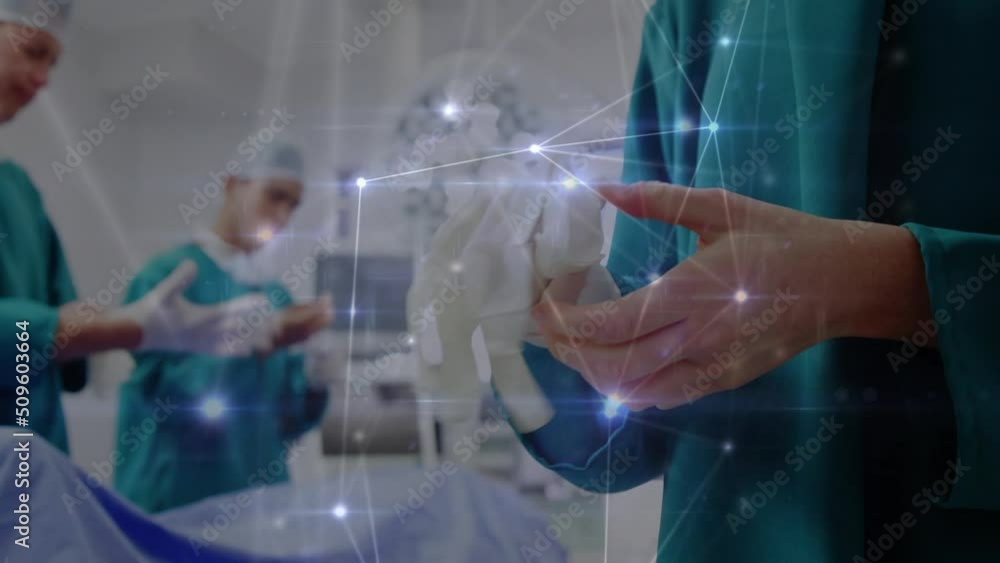 Poster animation of network of connections over two caucasian surgeons in operating theater