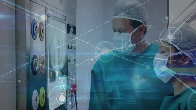 Animation of network of connections over two caucasian surgeons in operating theater