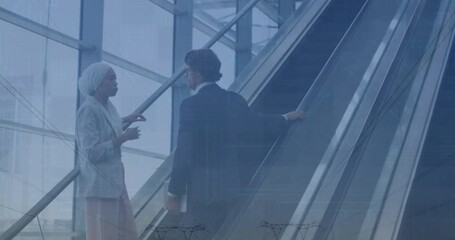 Animation of financial data and graphs over diverse businessman and businesswoman on escalator - Powered by Adobe