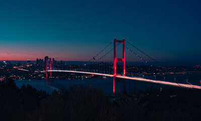 Fototapeta na wymiar 15th July Martyrs Bridge aka Bosphorus Bridge at night, long exposure with car trails.