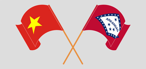 Crossed and waving flags of Vietnam and The State of Arkansas