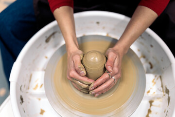 Fototapeta premium Making Pottery On Spinning Wheel