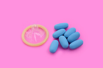 Obraz na płótnie Canvas Condom with PrEP ( Pre-Exposure Prophylaxis) used to prevent HIV. Safe sex concept.