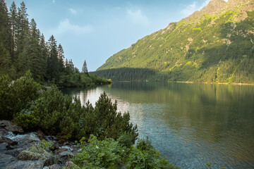 Fototapeta na wymiar Tatra National Park, Poland. Famous mountains lake Morskie Oko Or sea eye lake in summer evening. 