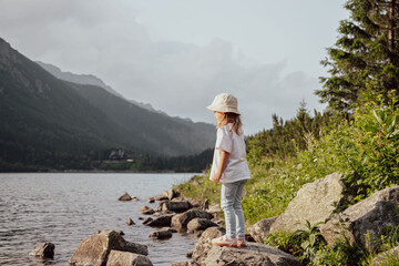 child in mountains at Morskie Oko lake near Zakopane, Tatra Mountains, Poland © Julija