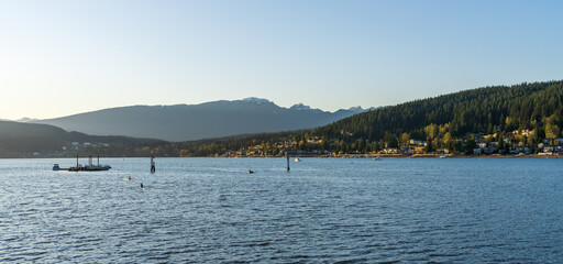 Burrard Inlet during sunset time. Rocky Point Park. Port Moody, British Columbia, Canada.