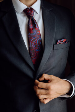 businessman adjusting his tie, man in suit
