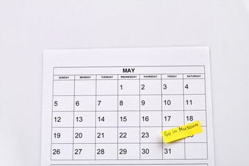 International museum day concept. May calendar isolated on white. Go in museum concept.