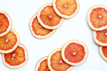 Fototapeta na wymiar Fresh grapefruit slices on white background.