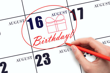 The hand circles the date on the calendar 16 August, draws a gift box and writes the text Birthday....