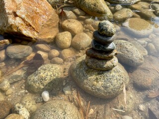 stacked stones at riverbank