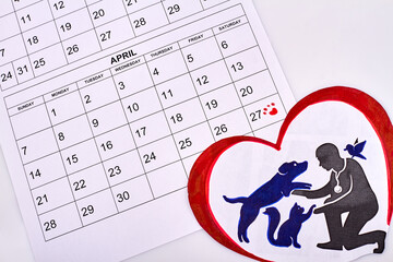 Animal rights day concept. Calendar with marked date. Silhouette of human with dog and cat.