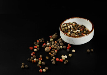 Unground pepper on a black background