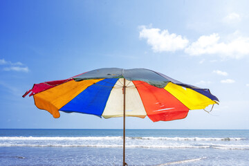 Beach with colorful umbrella in summer holiday