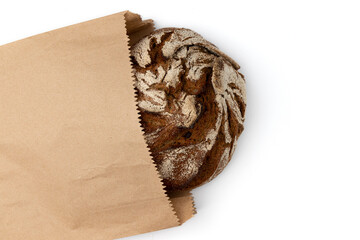 fresh rye bread in paper bag isolated on white background