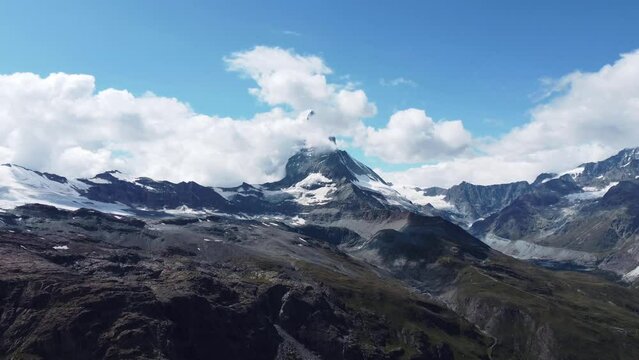 Drone footage of Matterhorn (Monte Cervino, Mont Cervin) and blue Stellisee lake. Sunny day. View of majestic mountain landscape. Valais Alps, Zermatt, Switzerland, Europe