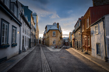 Fototapeta na wymiar Beautiful intersection of two narrow alleys under the dusk, Quebec Old town, QC, Canada