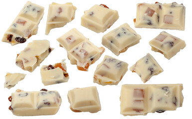 White chocolate. Pieces of white chocolate with nuts, raisins and candied fruit, flying on a white...