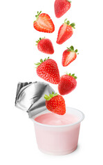 Many fresh red strawberries falling into plastic cup with yogurt on white background