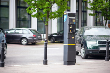 Parking meter on city street. Modern device