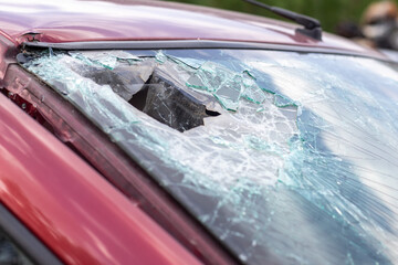 Close-up of a car with a broken windshield after a fatal crash. Consequence of a fatal car...