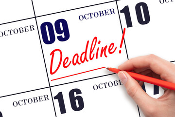 Hand drawing red line and writing the text Deadline on calendar date October 9. Deadline word...