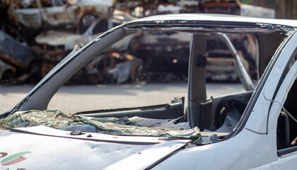 A car after an accident with a broken rear window. Broken window in a vehicle. The wreckage of the interior of a modern car after an accident, a detailed close-up view of the damaged car.