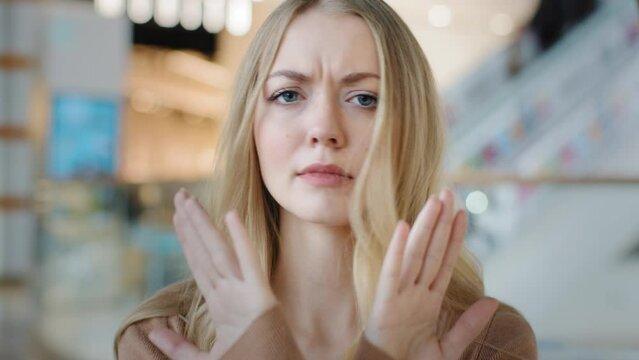 Caucasian girl woman serious listening answer no wave head negative opinion attitude lady crossing arms not sign ban forbid prohibition disagreement defense refusal failure rejection stop gesture