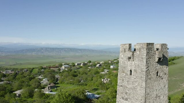 Close Up Detail Of The Tower Of Noste Castle Overlooking Townscape In Kaspi, Shida Kartli, Georgia. drone ascend