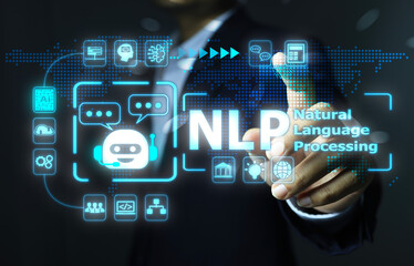 The businessman's hand reaches out to touch to activate NLP or Natural language processing to connect all activity as a chatbot artificial intelligence.