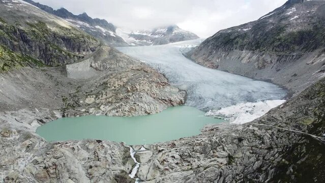 Aerial view of the Furka Pass in the Swiss Alps with the Rhone Glacier. Drone footage 4K. Epic view.