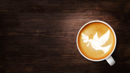 Fototapeta na wymiar Dove bird with olive branch foam in a cup of coffee. Spiritual religion theme concept.