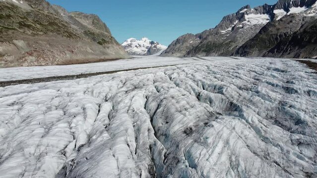Aerial view of Great Aletsch Glacier, Alps, Switzerland. Drone footage 4K.