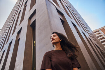 Beautiful businesswoman standing and looking away