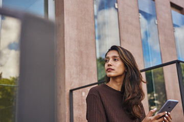 Fototapeta premium Young beautiful businesswoman looking and thinking