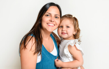 Mother with his daughter on studio white background