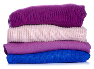 Stack foded sweaters clothes on white background isolation