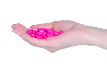 pink pills drug in hand on white background isolation