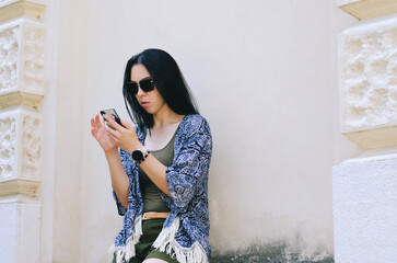 Portrait of young happy business woman relaxing in city, park at Adriatic seaside. Using phone. Selfie. technology. Social media. Video call. Summer vacation