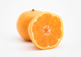 whole and slice Tangerine or kamala over on white background