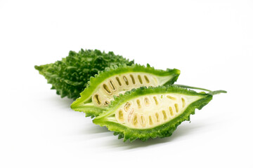 bitter melon or bitter gourd slices isolated on white background, selective focus