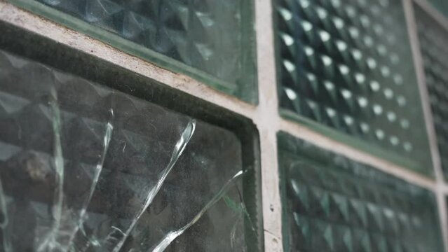 Gun Shot Hole in Thick Window, Vandalising Concept