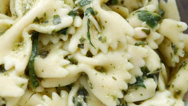 Delicious farfalle pasta with pesto and garlic dish