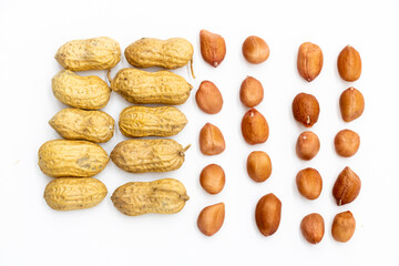 peeled and Unpeeled peanuts isolated on white. Top view.